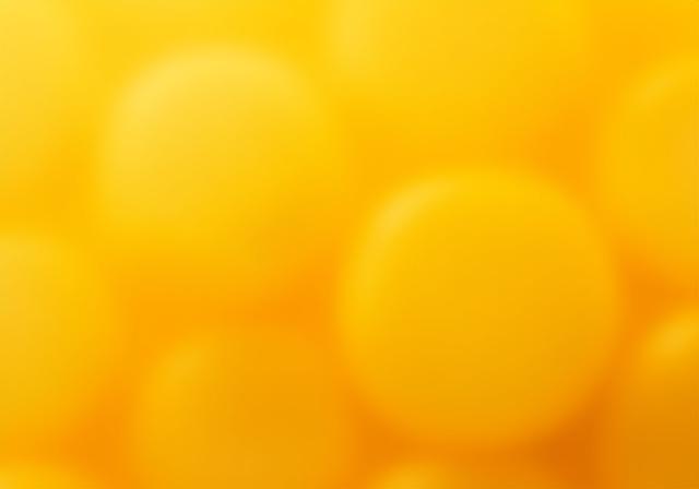 Detalle macro de perlas de cera de abeja natural.